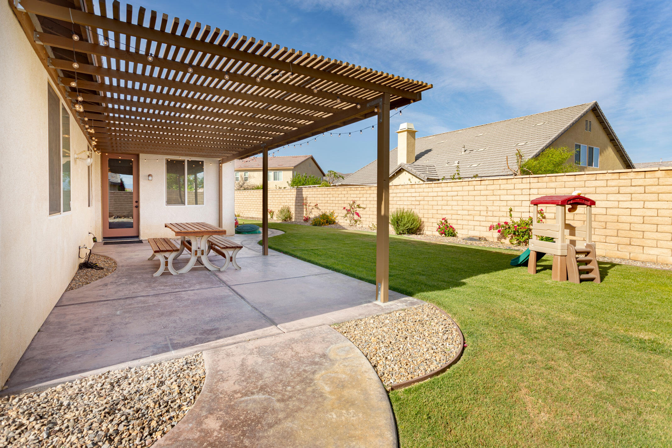 37196 Sandwell Street Indio, CA 92203 - Photo 19 of 34 a view of a backyard with swimming pool