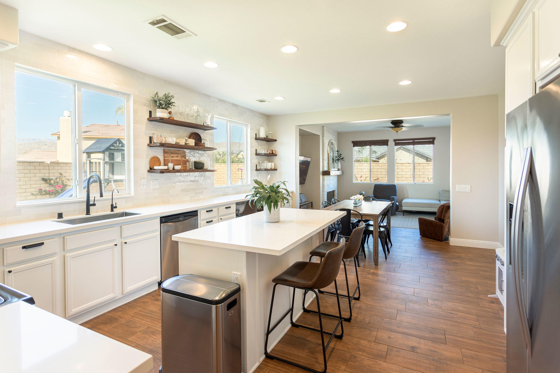 37196 Sandwell Street Indio, CA 92203 - Photo 2 of 34 a large kitchen with a table and chairs
