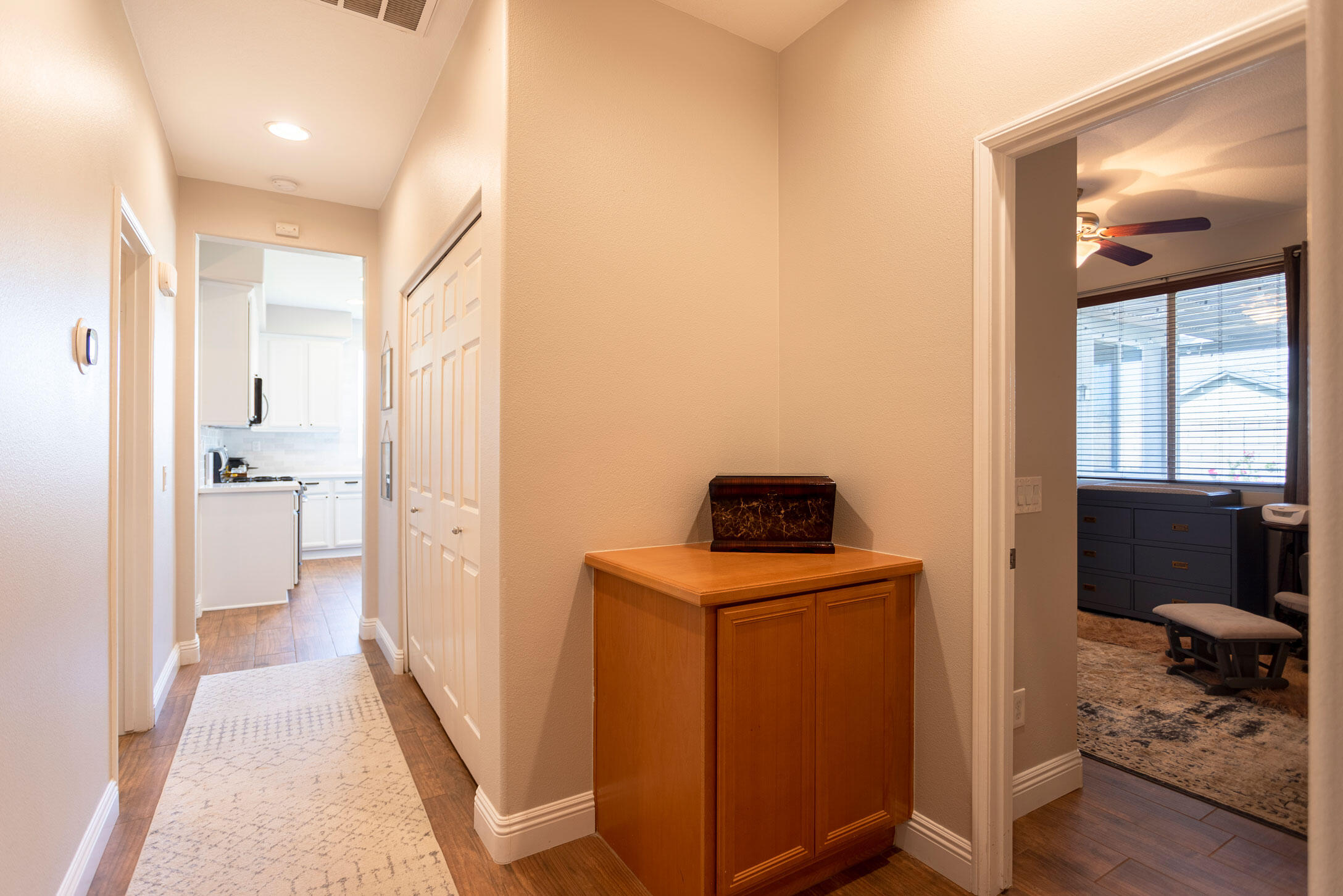 37196 Sandwell Street Indio, CA 92203 - Photo 32 of 34 a view of a hallway and a livingroom with furniture