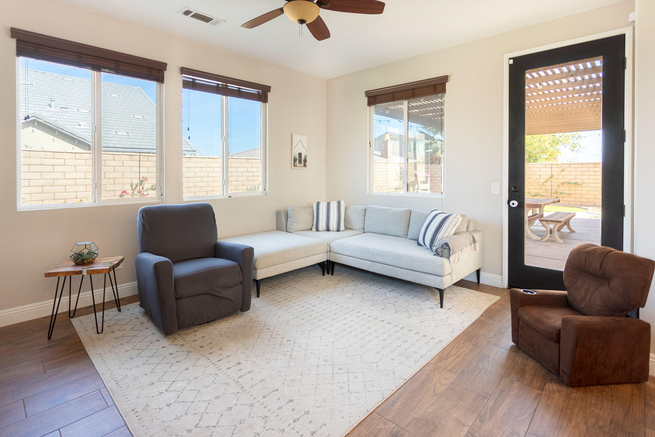 37196 Sandwell Street Indio, CA 92203 - Photo 10 of 34 a living room with furniture and a large window