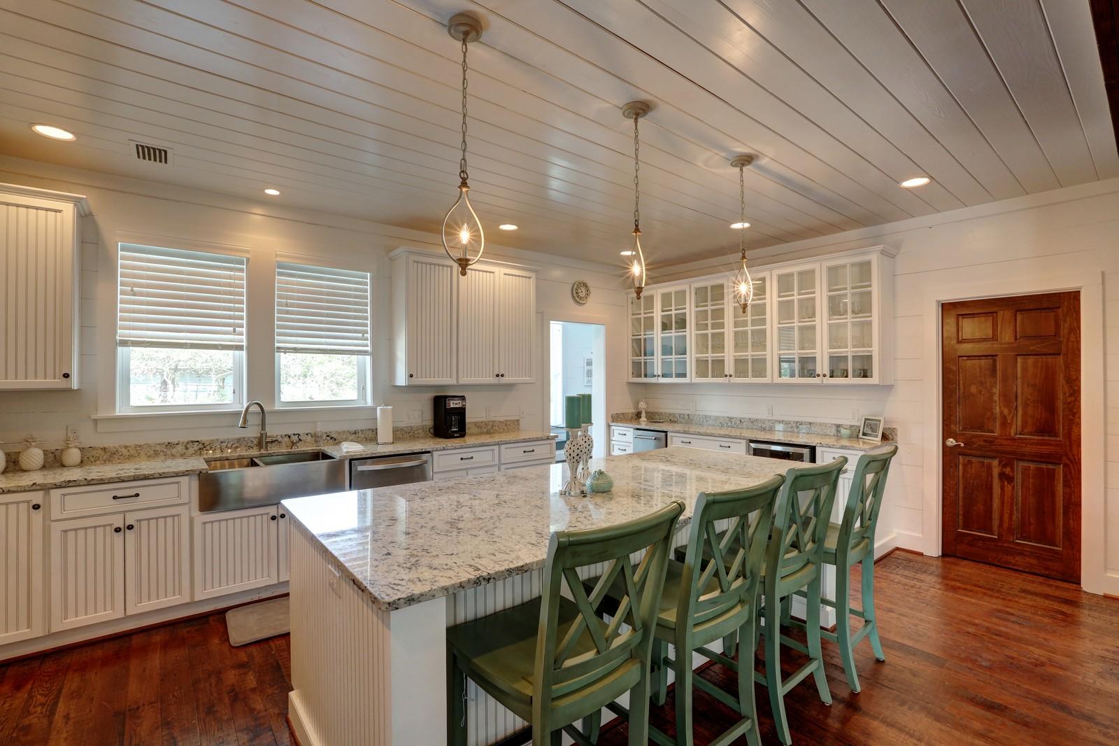 72 Gulf Point Road Santa Rosa Beach, FL 32459 - Photo 18 of 47 a kitchen with lots of counter space and dining table