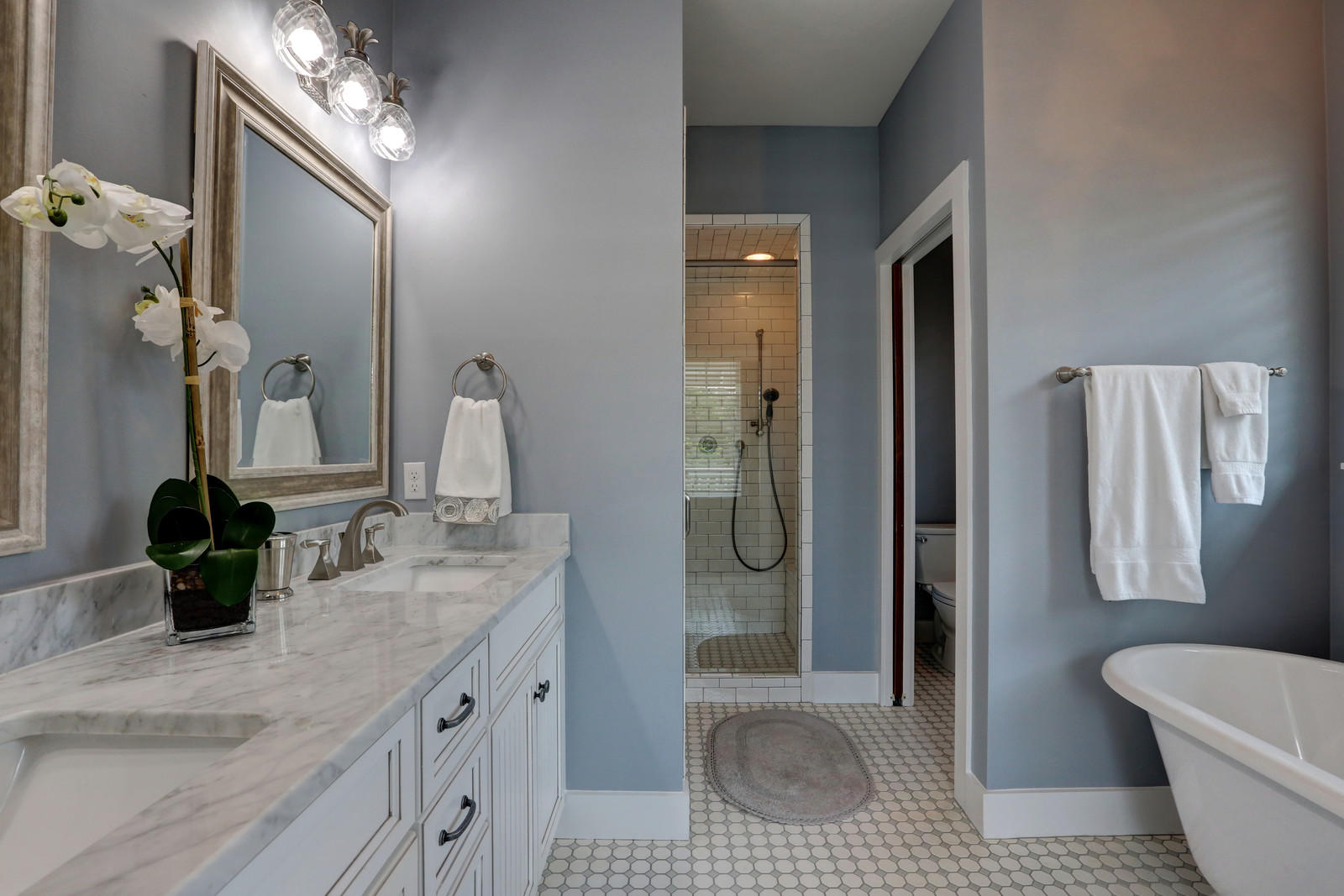 72 Gulf Point Road Santa Rosa Beach, FL 32459 - Photo 27 of 47 a bathroom with a double vanity sink a toilet and shower