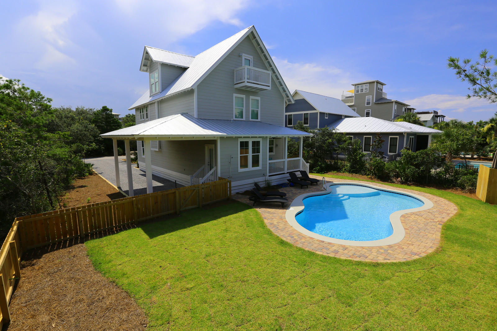 72 Gulf Point Road Santa Rosa Beach, FL 32459 - Photo 4 of 47 a view of a house with swimming pool and yard