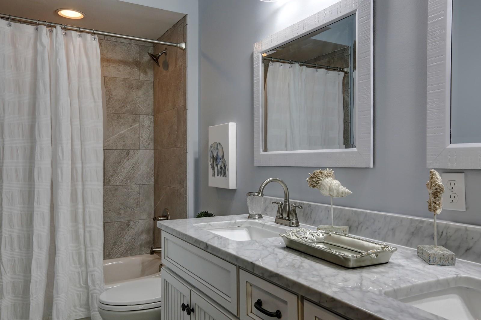 72 Gulf Point Road Santa Rosa Beach, FL 32459 - Photo 32 of 47 a bathroom with a granite countertop sink toilet and shower