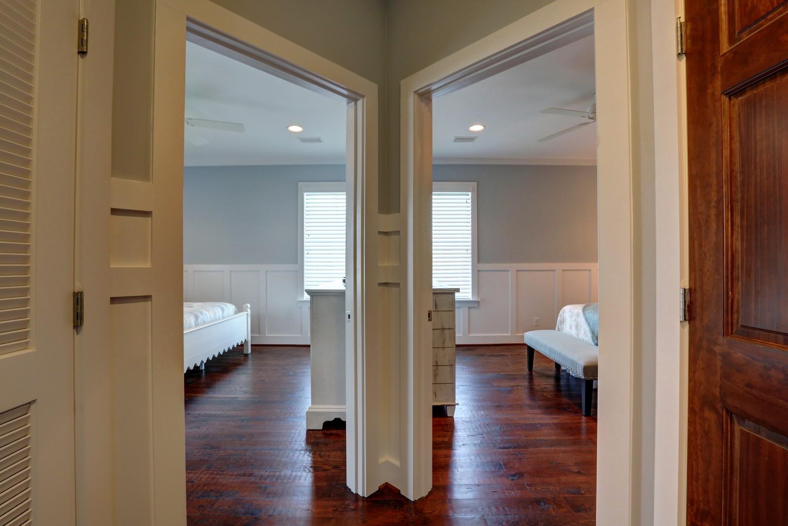 72 Gulf Point Road Santa Rosa Beach, FL 32459 - Photo 33 of 47 a view of a hallway with wooden floor windows and a bathroom