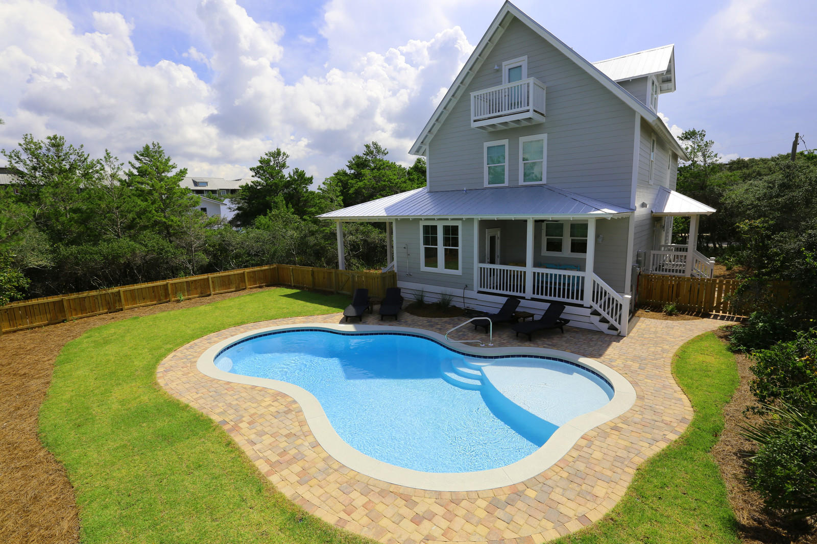 72 Gulf Point Road Santa Rosa Beach, FL 32459 - Photo 5 of 47 a view of a house with swimming pool and a yard