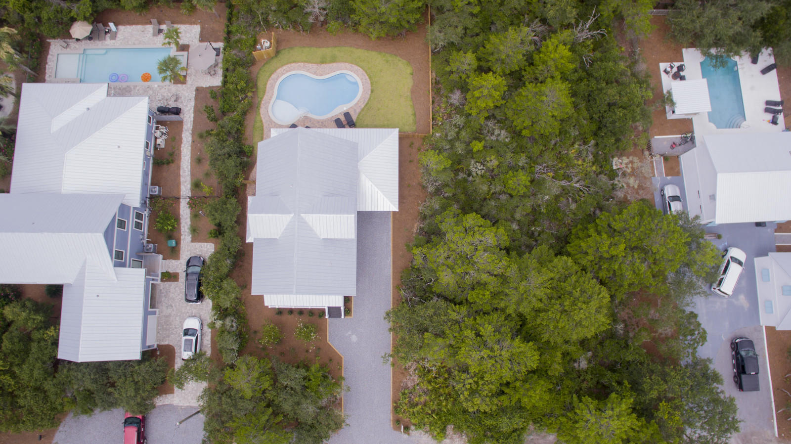 72 Gulf Point Road Santa Rosa Beach, FL 32459 - Photo 45 of 47 an aerial view of a house with outdoor space and parking