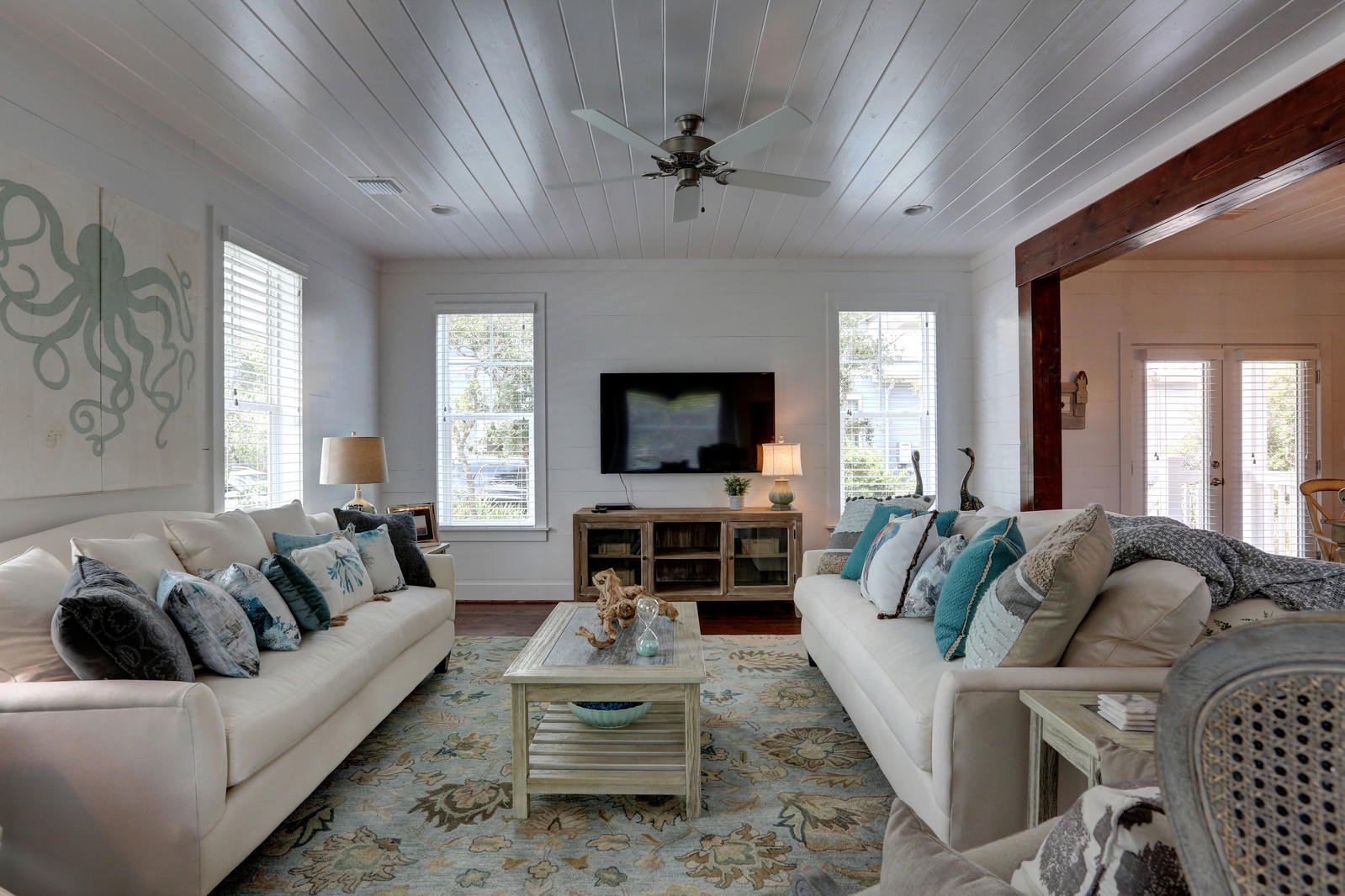 72 Gulf Point Road Santa Rosa Beach, FL 32459 - Photo 9 of 47 a living room with furniture a flat screen tv and a large window