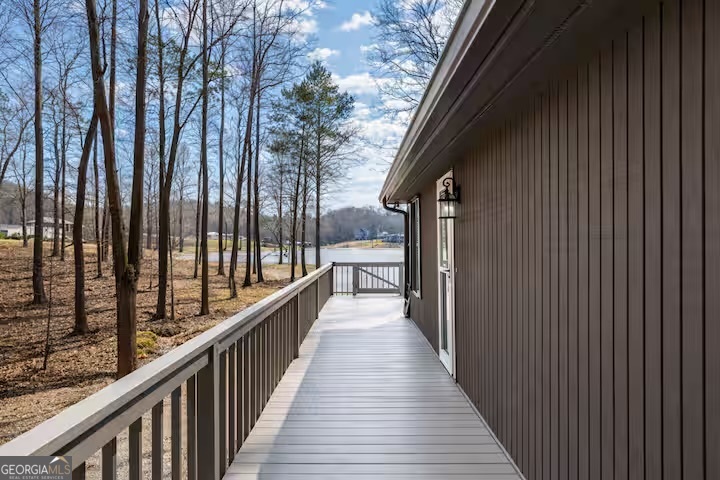 68 Franklin Road Eatonton, GA 31024 - Photo 2 of 28 a view of balcony with wooden floor and fence