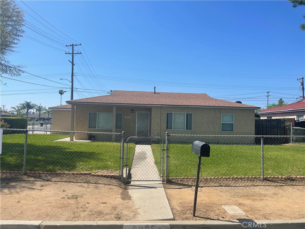 9056 Philbin Avenue Riverside, CA 92503 - Photo 1 of 1 a front view of a house with a yard