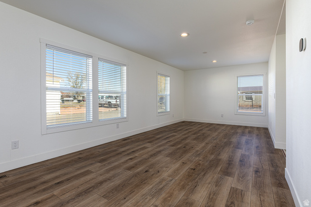 749 Riddle Drive Fredonia, AZ 86022 - Photo 23 of 41 Unfurnished room featuring dark wood-style flooring and recessed lighting