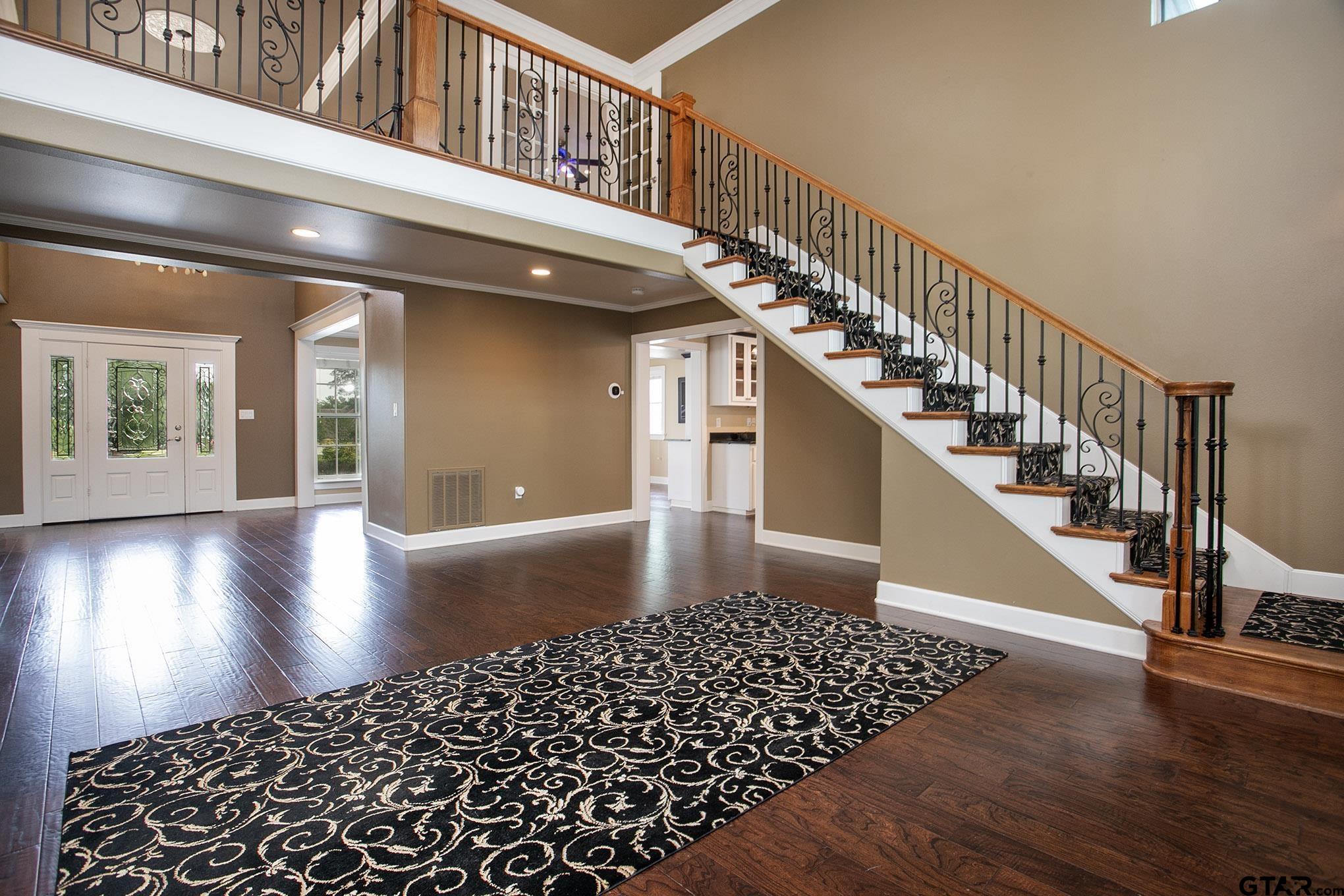 18722 Ridgeline Road Tyler, TX 75703 - Photo 25 of 47 Large open Space with high ceilings. Open to Entry and upstairs balcony.