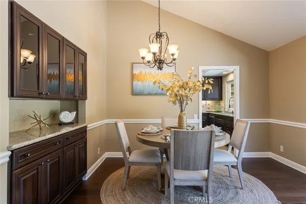a kitchen with granite countertop a sink and a stove