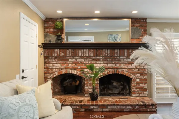 a living room with furniture a table and a chandelier