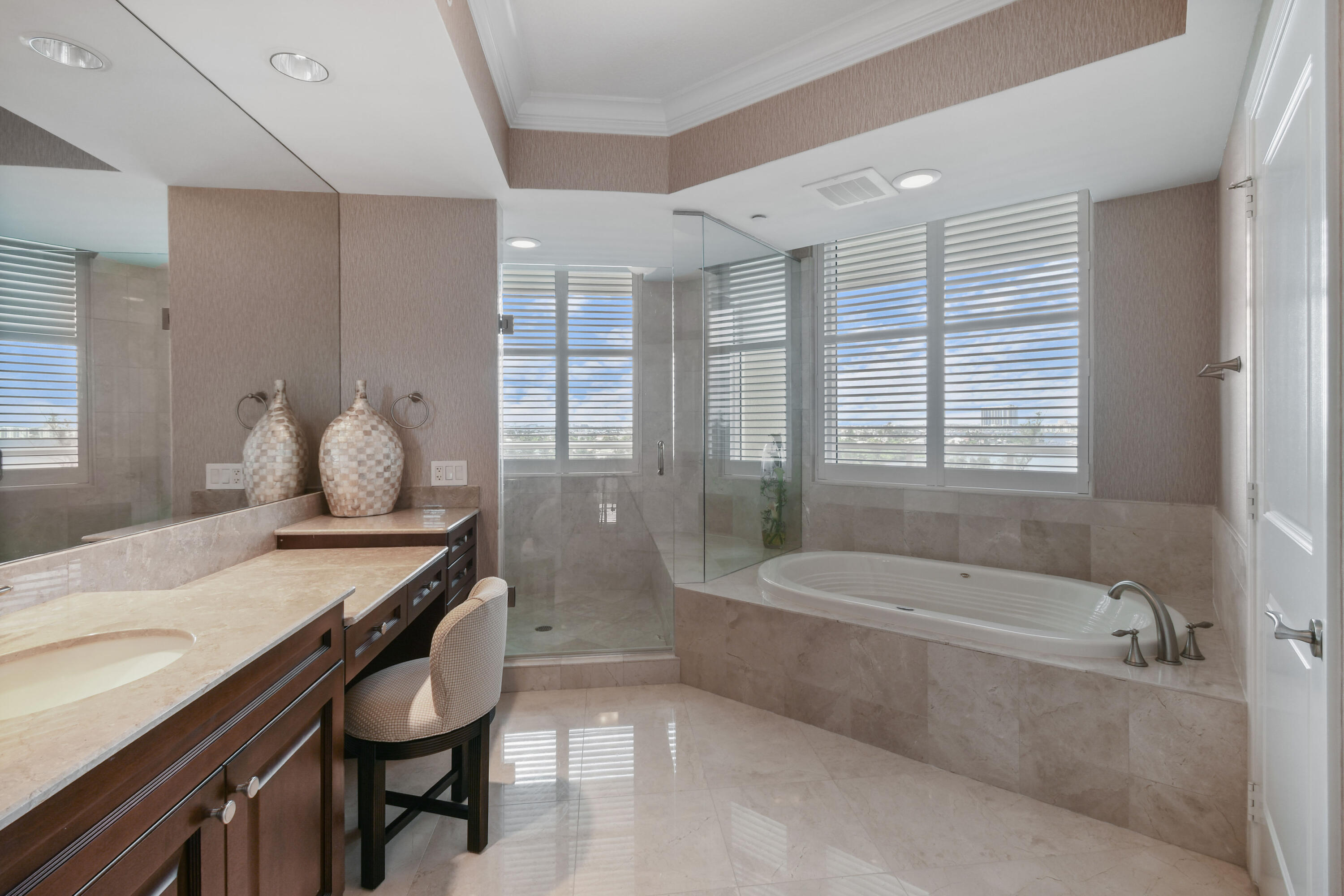 5050 North Ocean Drive, Unit 703 Singer Island, FL 33404 - Photo 14 of 52 a bathroom with a granite countertop sink a toilet and bathtub