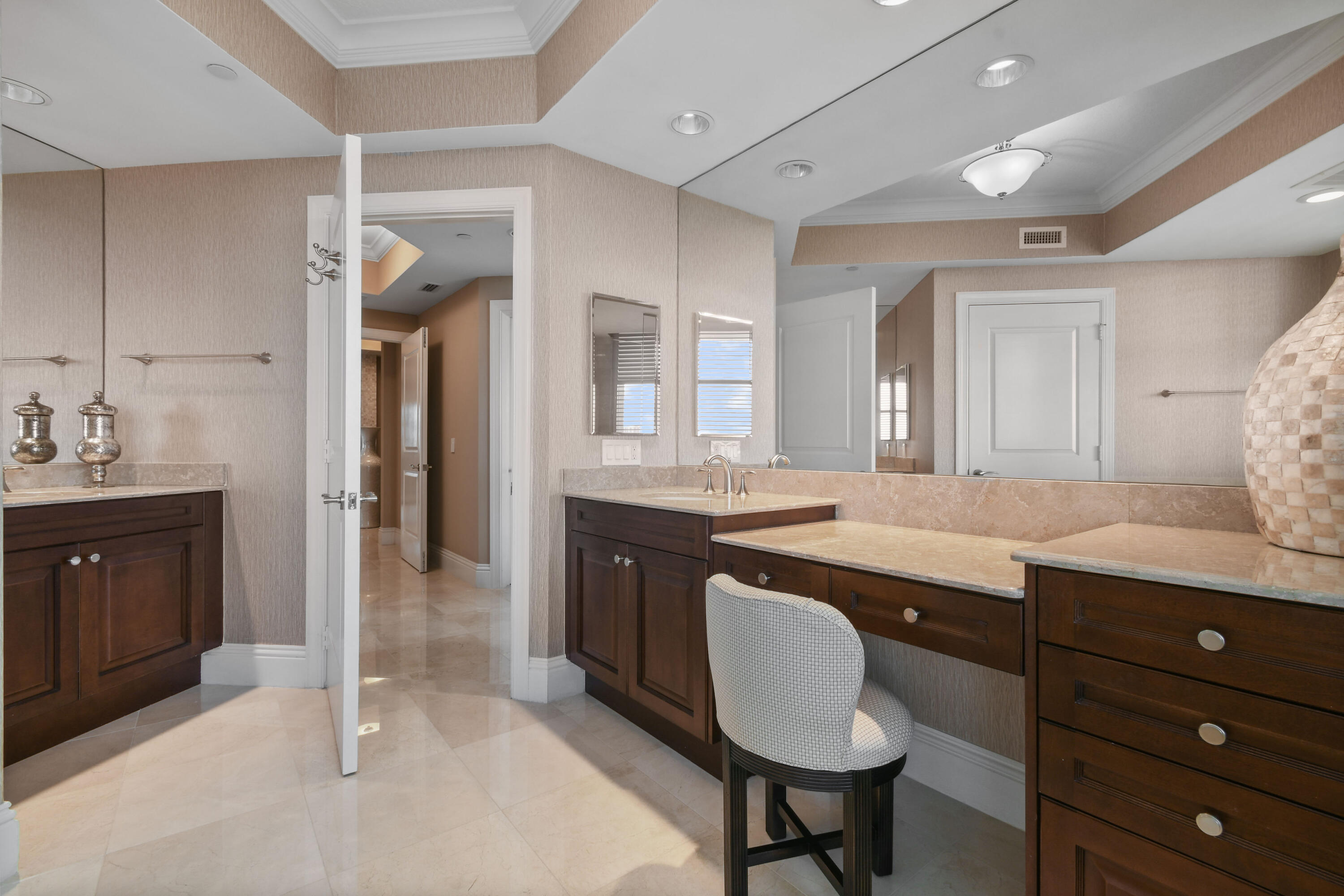 5050 North Ocean Drive, Unit 703 Singer Island, FL 33404 - Photo 15 of 52 a spacious bathroom with a granite countertop sink and a mirror