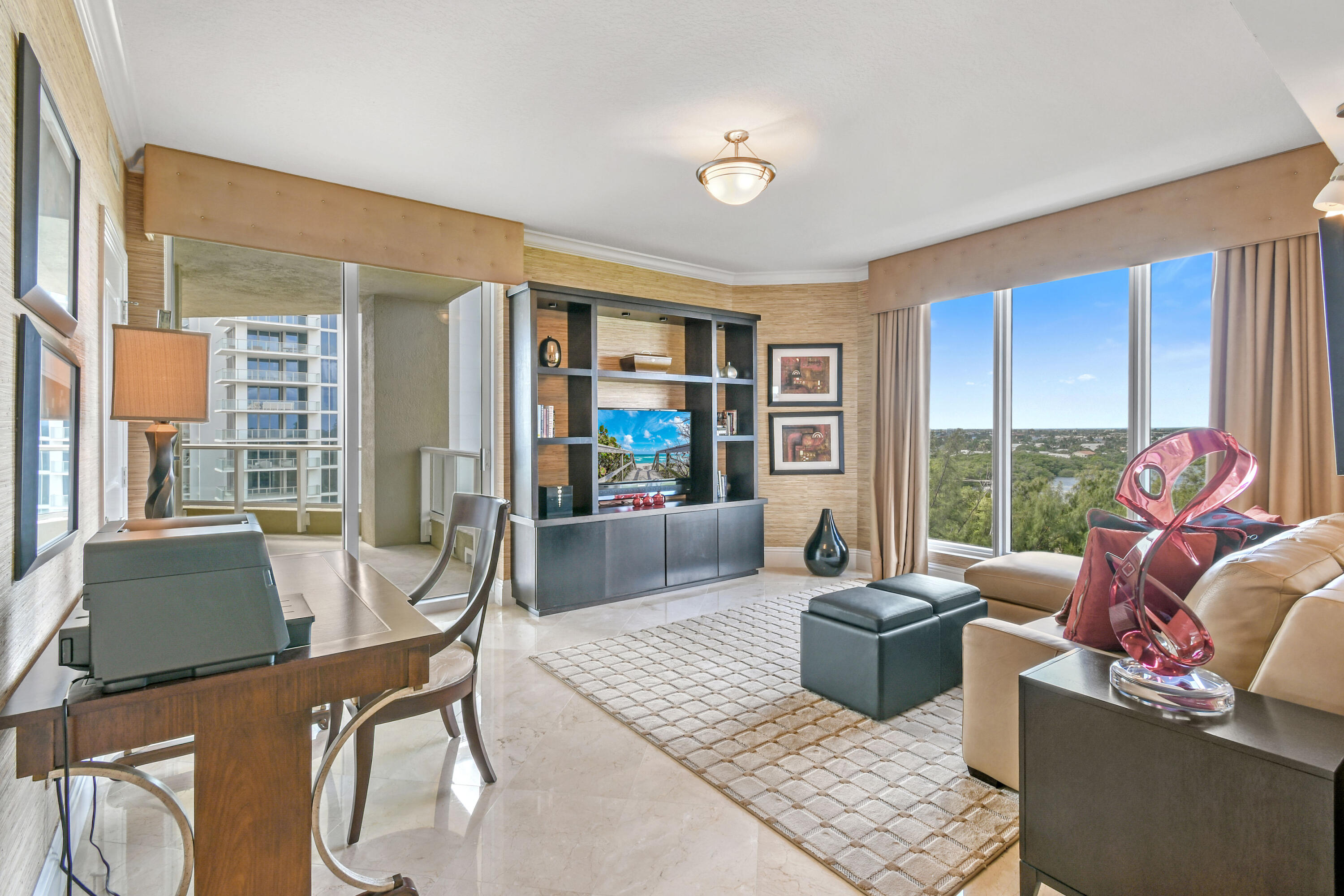 5050 North Ocean Drive, Unit 703 Singer Island, FL 33404 - Photo 18 of 52 a living room with furniture rug and window