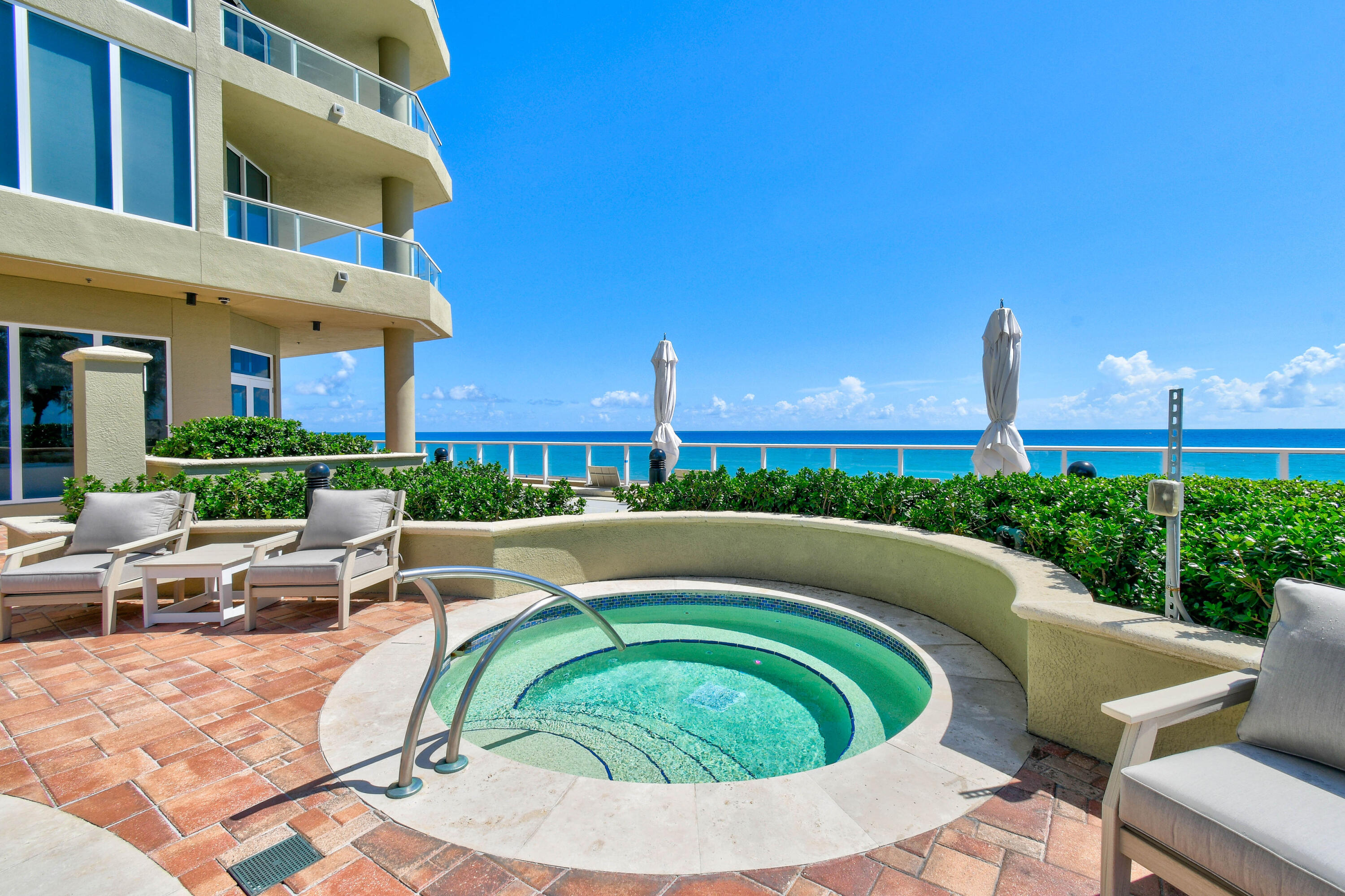 5050 North Ocean Drive, Unit 703 Singer Island, FL 33404 - Photo 40 of 52 a view of a swimming pool with a patio