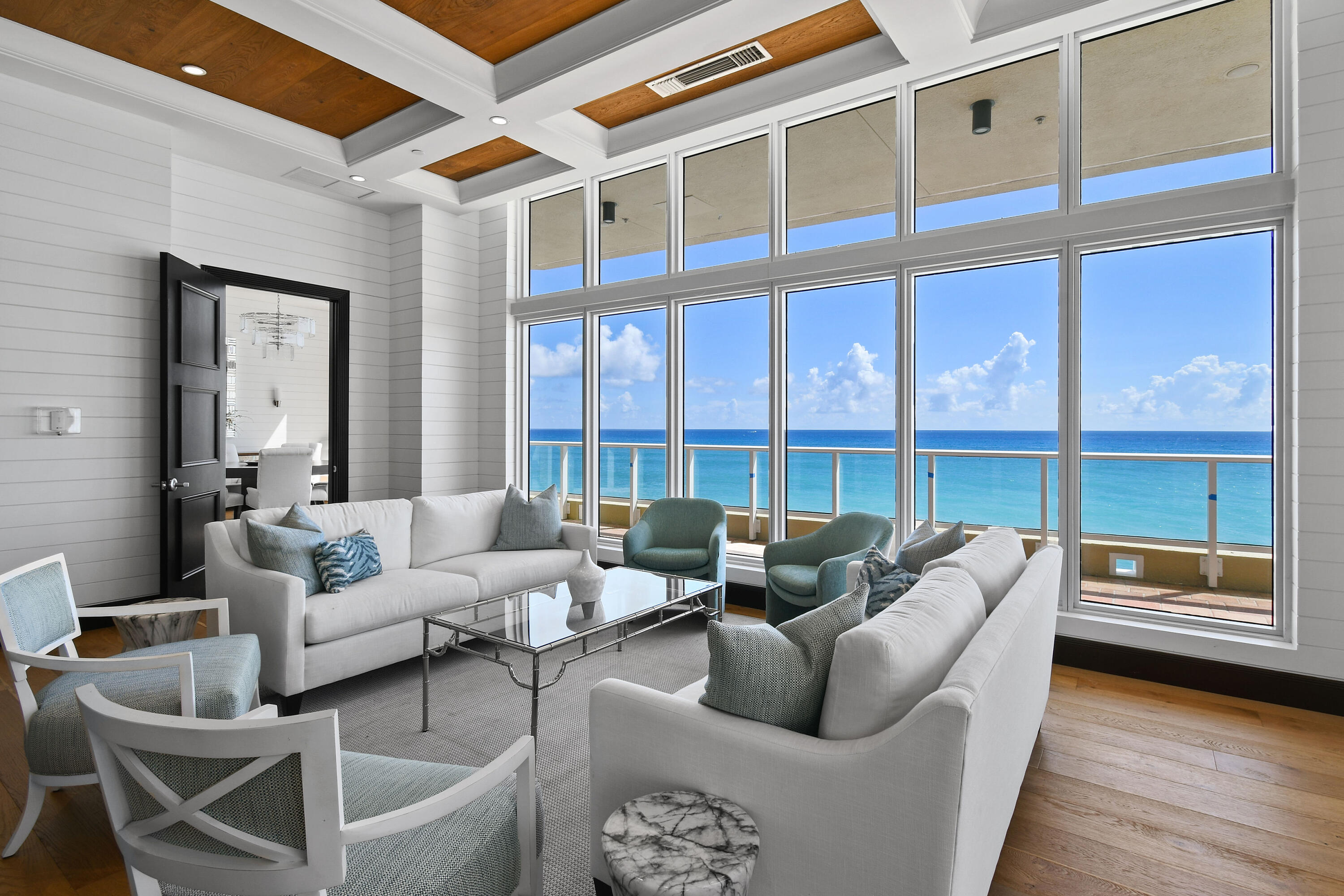 5050 North Ocean Drive, Unit 703 Singer Island, FL 33404 - Photo 46 of 52 a living room with furniture and a floor to ceiling window