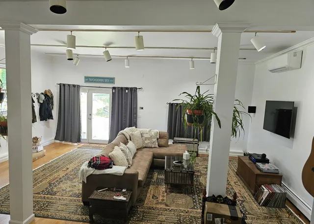 a view of a grassy field with trees