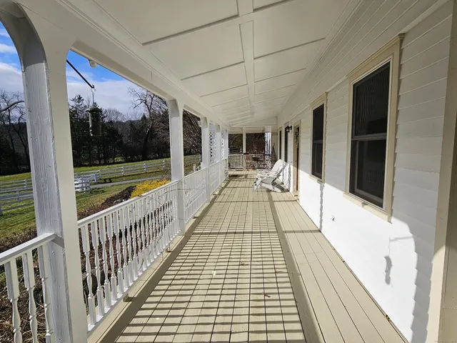 a view of wooden floor with a window