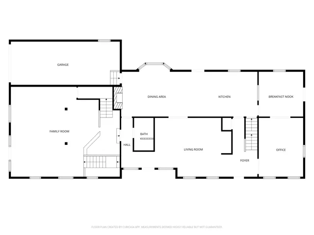 a front view of a house with plants