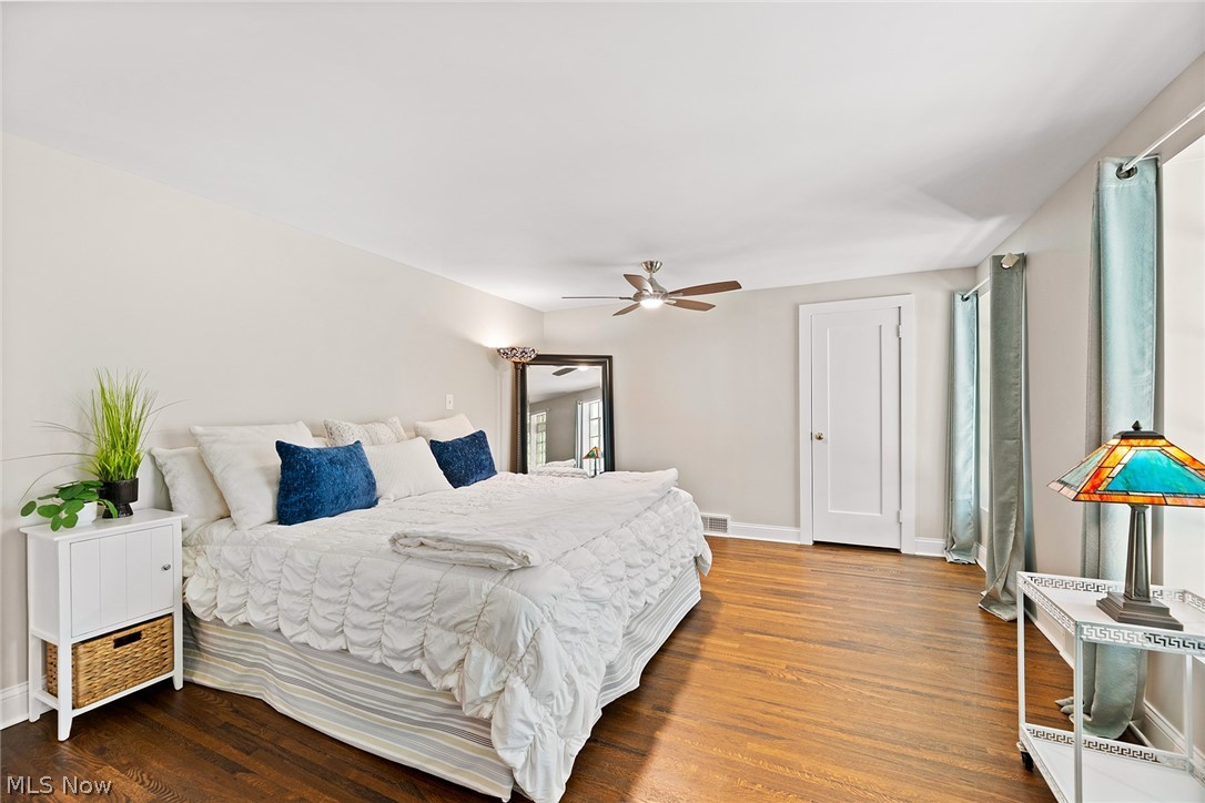 1375 North Revere Road Akron, OH 44333 - Photo 23 of 50 Hardwood flooring and a ceiling fan with integrated lighting