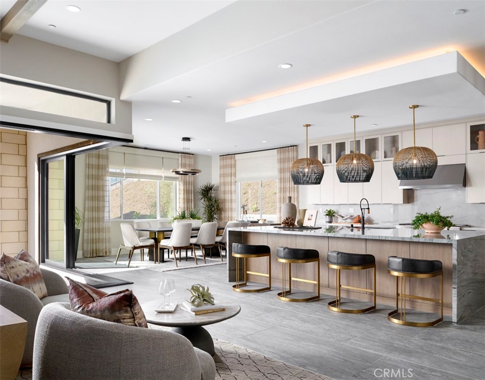 18461 Boulder Bluff Silverado, CA 92676 - Photo 6 of 12 a living room with stainless steel appliances kitchen island granite countertop furniture and a large window