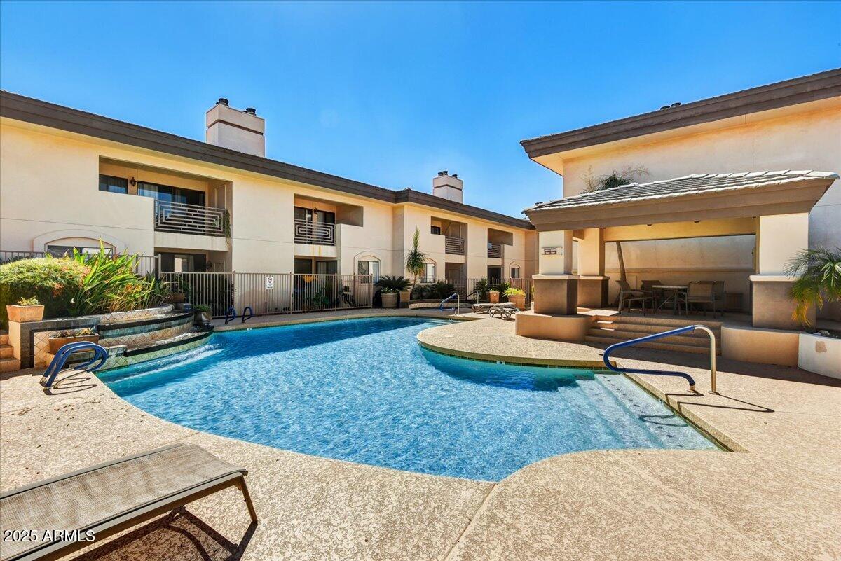 3235 East Camelback Road, Unit 218 Phoenix, AZ 85018 - Photo 20 of 23 a view of a house with backyard and sitting area