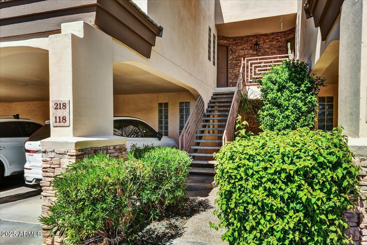 3235 East Camelback Road, Unit 218 Phoenix, AZ 85018 - Photo 2 of 23 a front view of a house with a yard