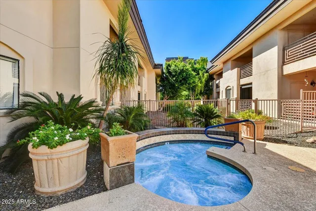 a swimming pool with outdoor seating