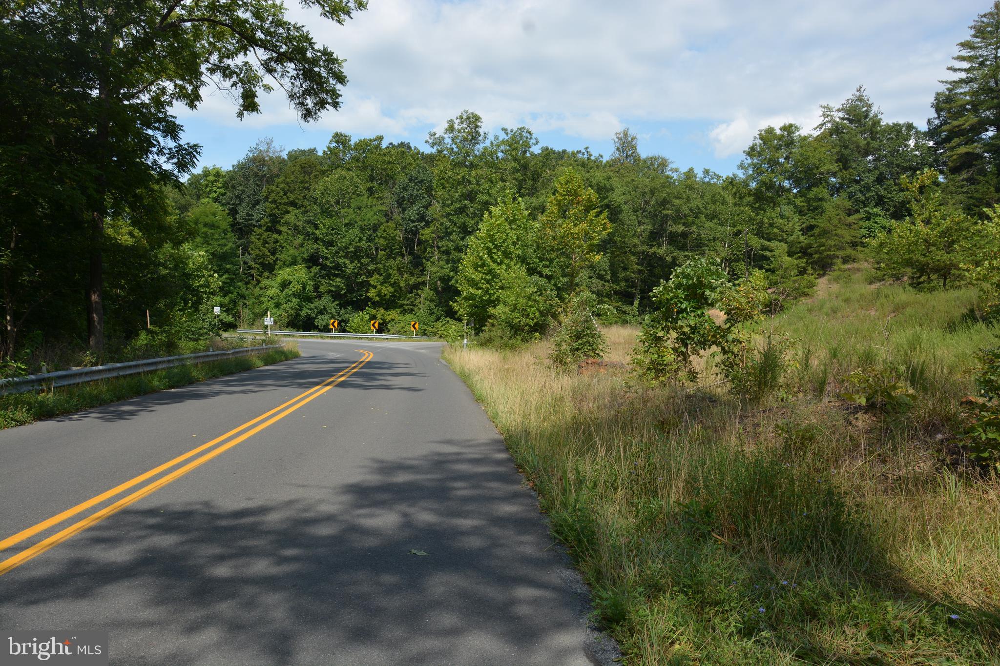 Brush Creek Road, Unit 30 Winchester, VA 22603 - Photo 7 of 39 a view of a street with a yard