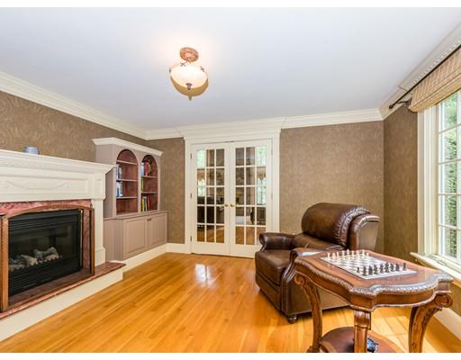 52 Crestview Road Milton, MA 02186 - Photo 14 of 25 a living room with furniture and a fireplace