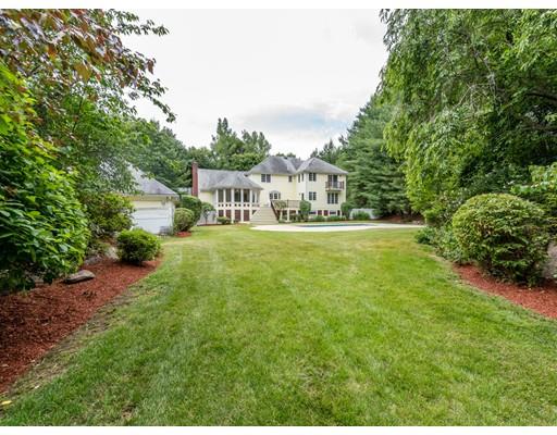52 Crestview Road Milton, MA 02186 - Photo 20 of 25 a view of a house with a big yard and large trees