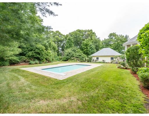 52 Crestview Road Milton, MA 02186 - Photo 21 of 25 a view of pool with table and chairs under an umbrella