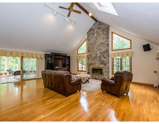 52 Crestview Road Milton, MA 02186 - Photo 4 of 25 a living room with furniture and a fireplace