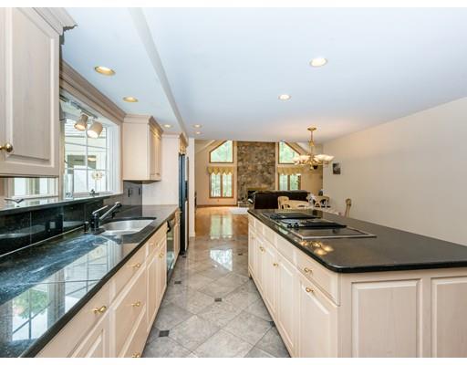 52 Crestview Road Milton, MA 02186 - Photo 10 of 25 a kitchen with stainless steel appliances granite countertop a sink stove and cabinets