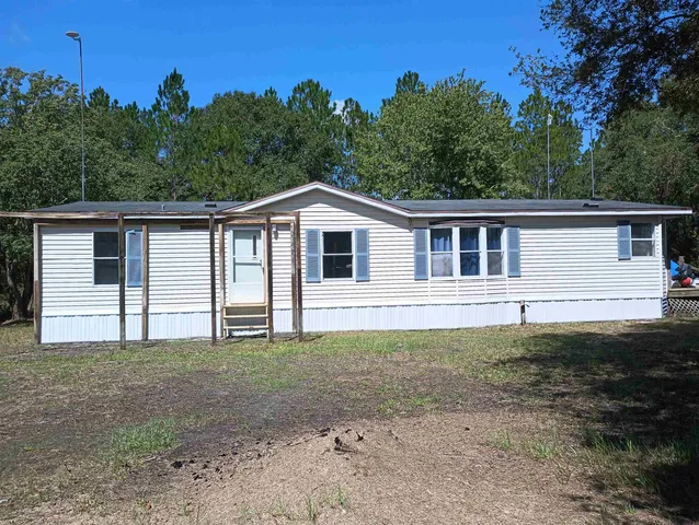 a house with trees in the background