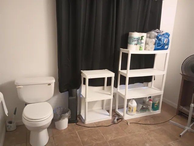 a bathroom with a toilet and a sink