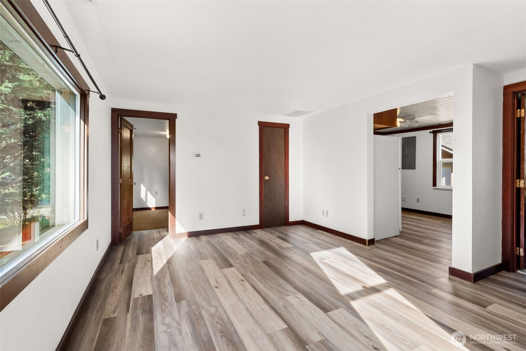 1000 Creso Road South Spanaway, WA 98387 - Photo 32 of 40 a view of a livingroom with wooden floor and stairs