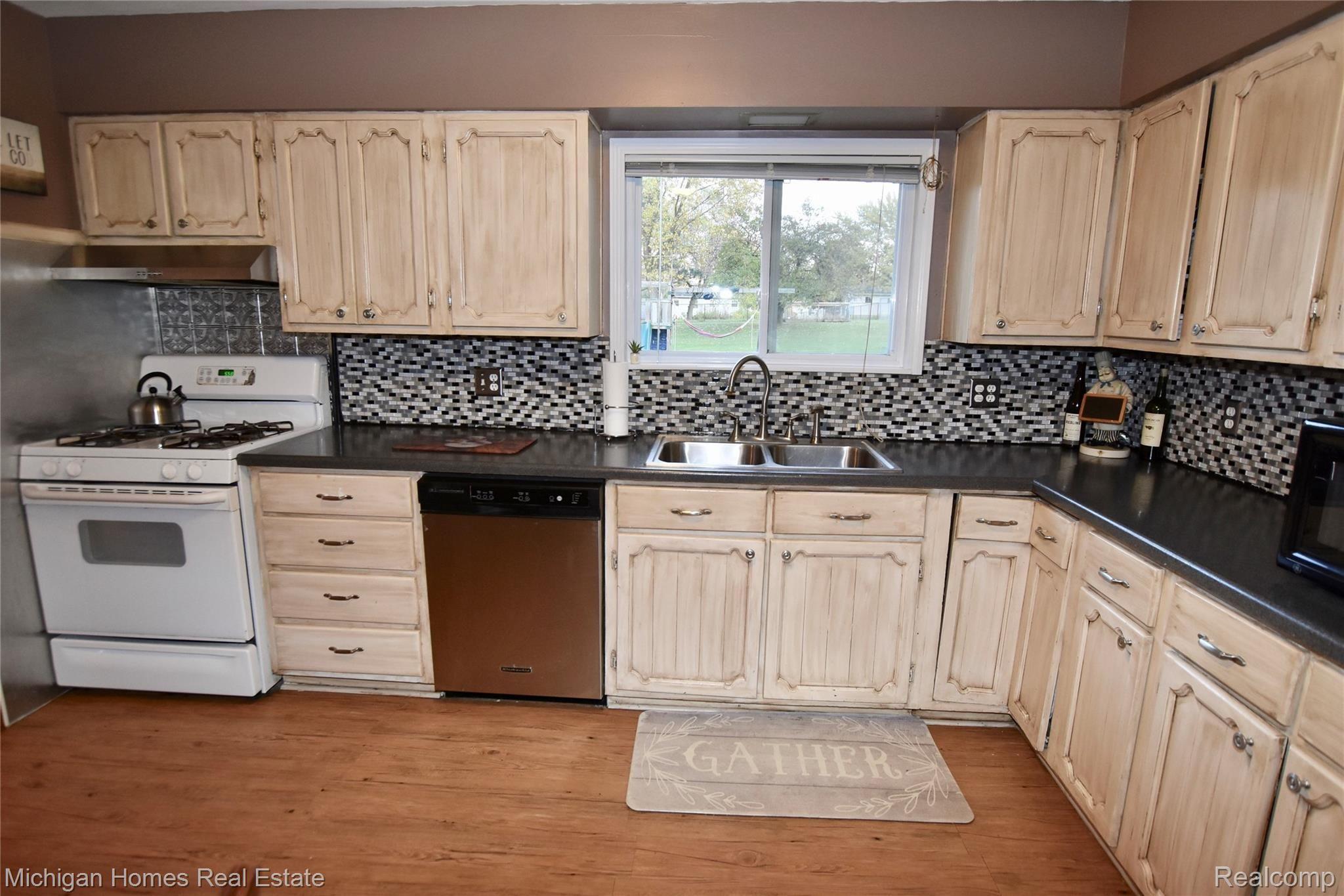 5377 Howe Road Grand Blanc, MI 48439 - Photo 8 of 22 Large kitchen/dining area with a lot of cabinets and counter space.