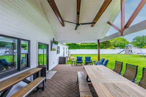 a view of a patio with a table chairs and a patio