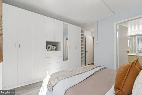 a bedroom with a bed and a chair