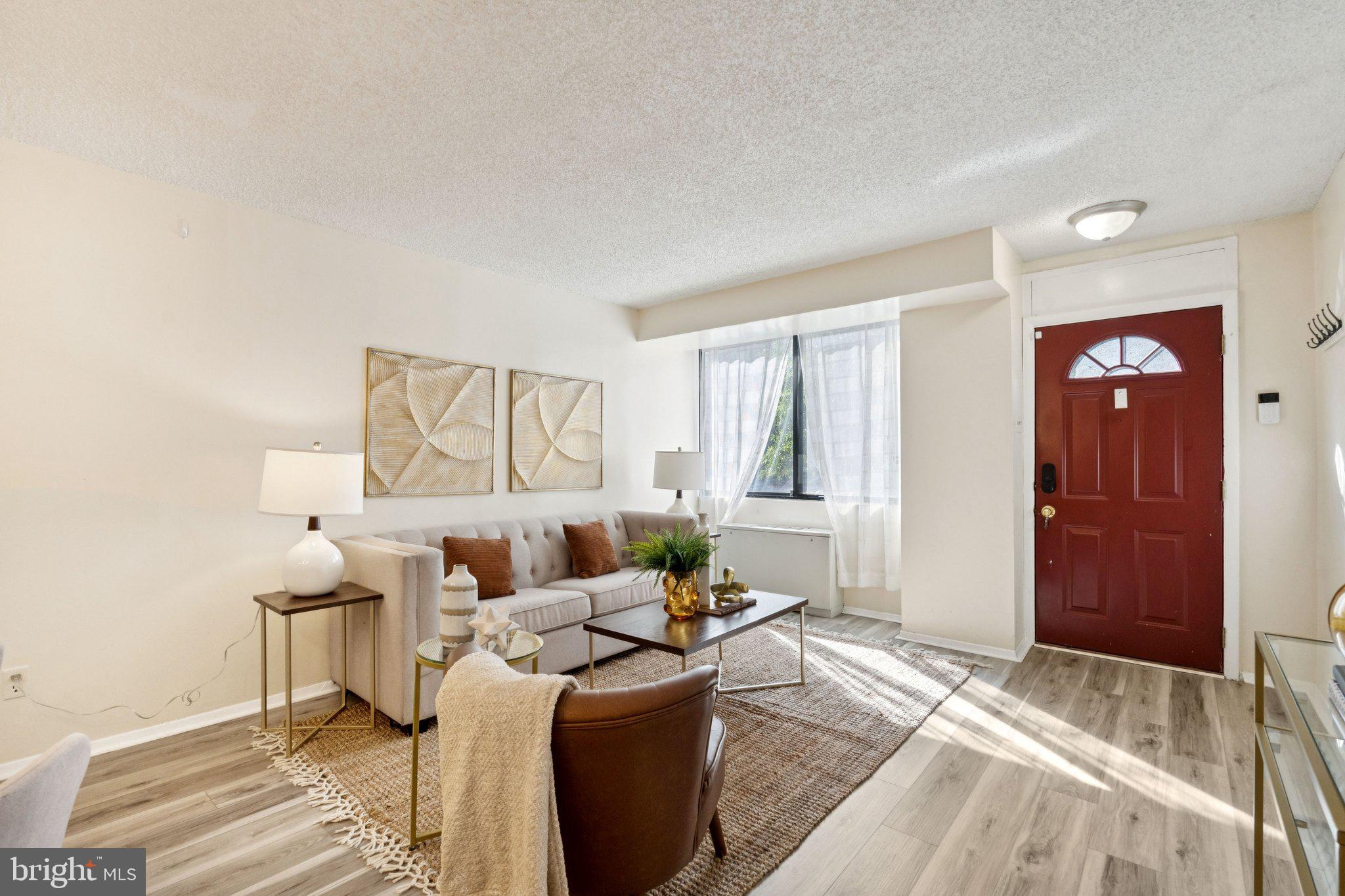1245 13th Street Northwest, Unit 109 Washington, DC 20005 - Photo 19 of 25 a living room with furniture and a window