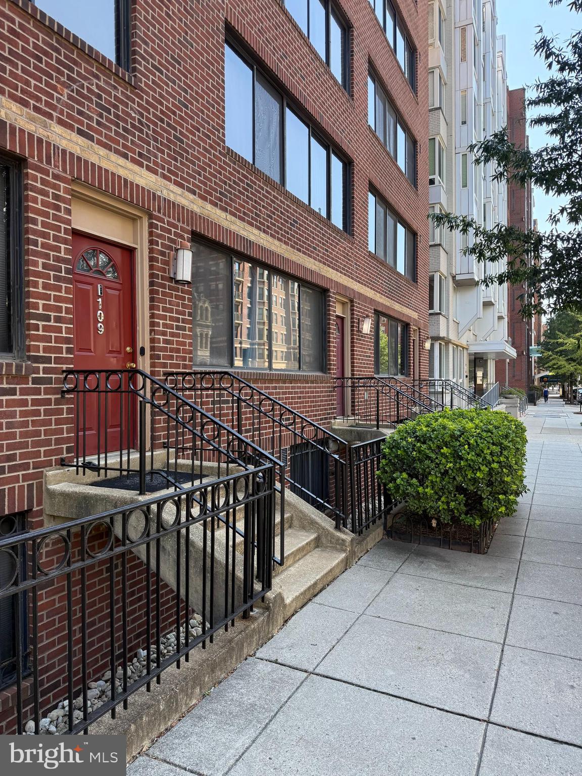 1245 13th Street Northwest, Unit 109 Washington, DC 20005 - Photo 2 of 25 a view of a brick building with many windows