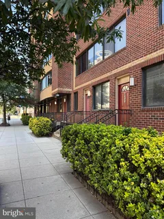a front view of a building with garden