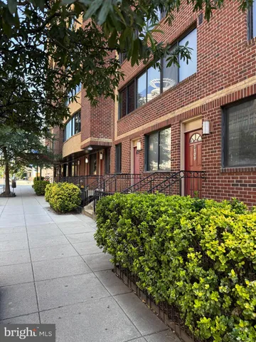 a front view of a building with garden