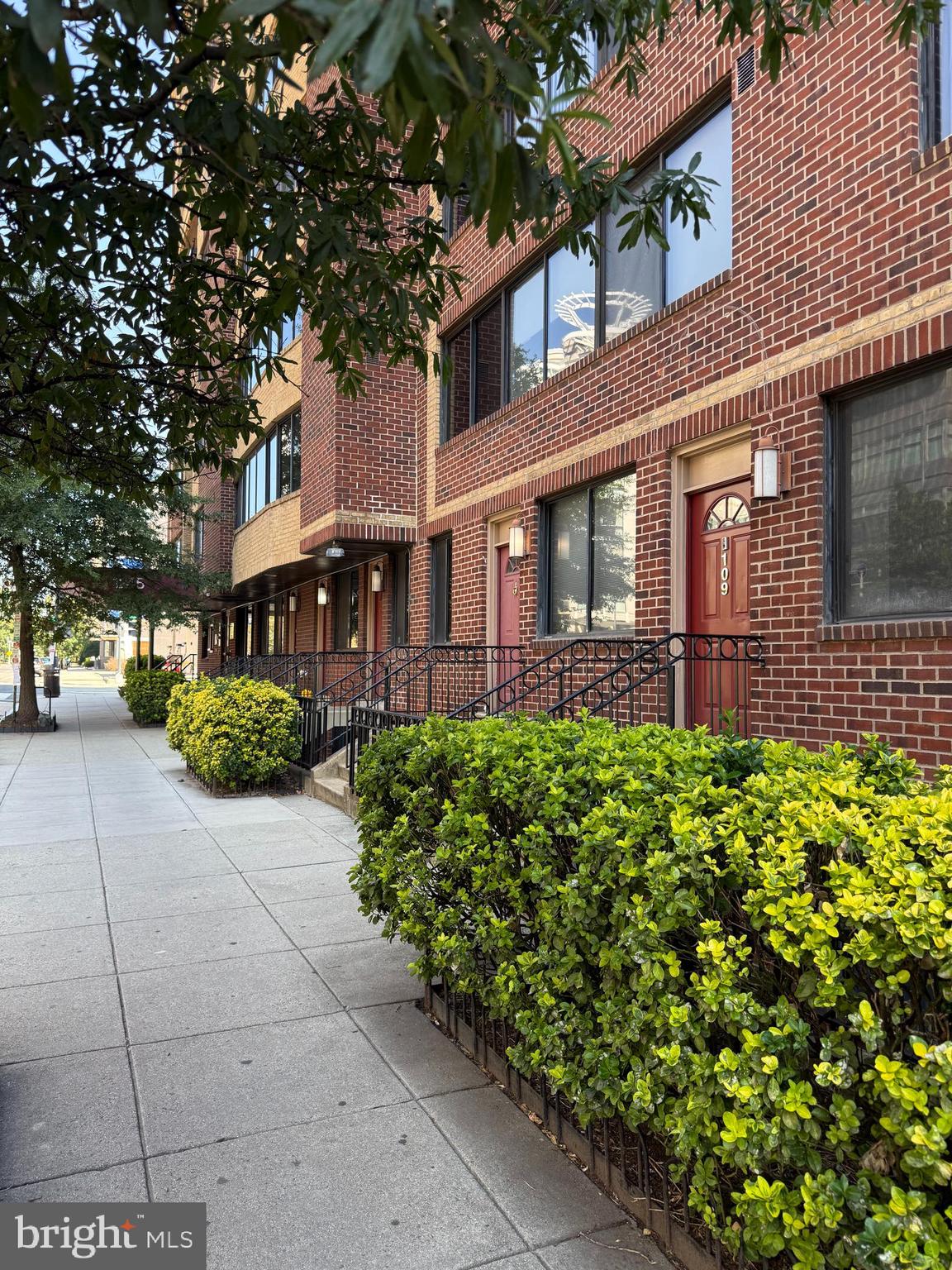 1245 13th Street Northwest, Unit 109 Washington, DC 20005 - Photo 25 of 25 a front view of a building with garden