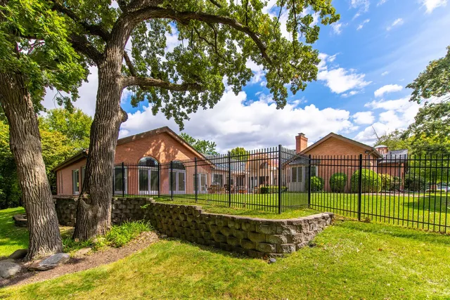 a view of a house with backyard porch and sitting area