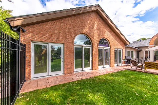 a view of a house with swimming pool and porch